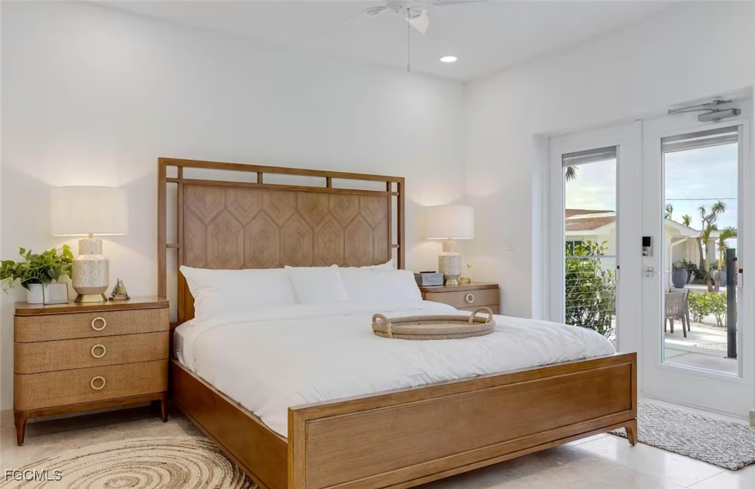 2740 North Beach Road, Unit A & B Englewood, FL 34223 - Photo 40 of 43 a bedroom with a bed and window