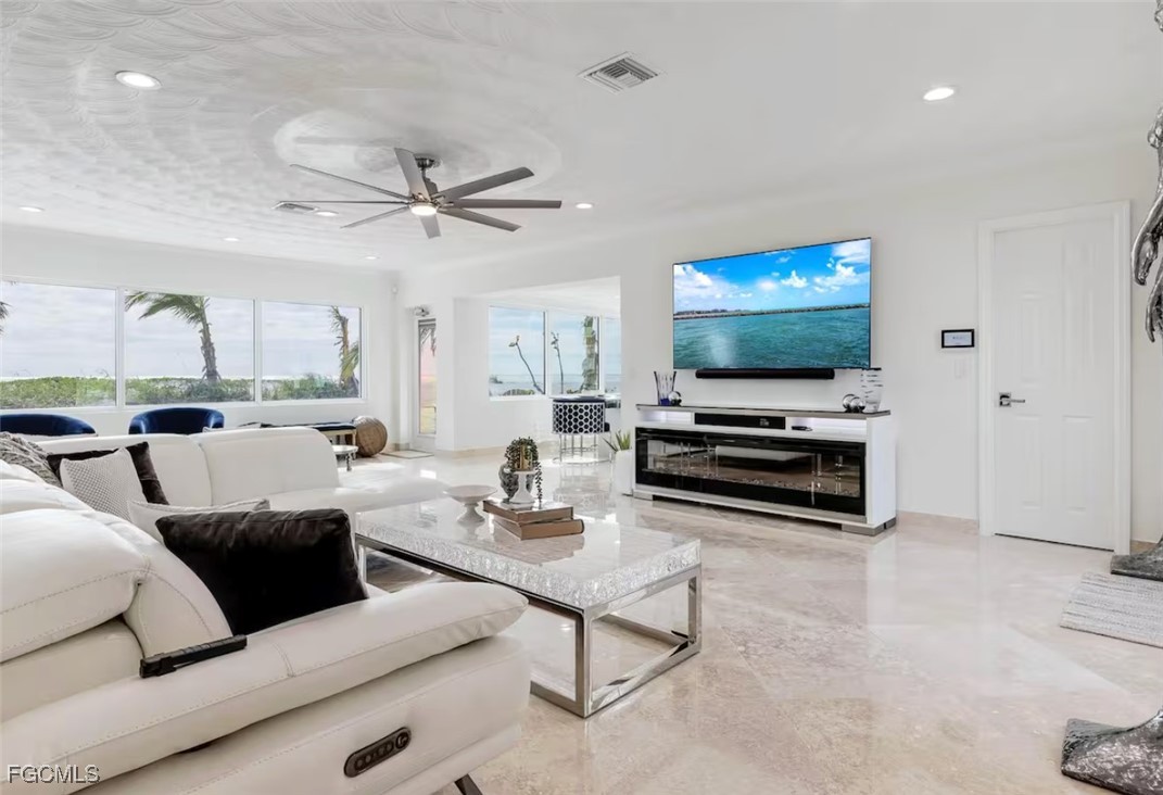 2740 North Beach Road, Unit A & B Englewood, FL 34223 - Photo 7 of 43 a living room with furniture and a flat screen tv