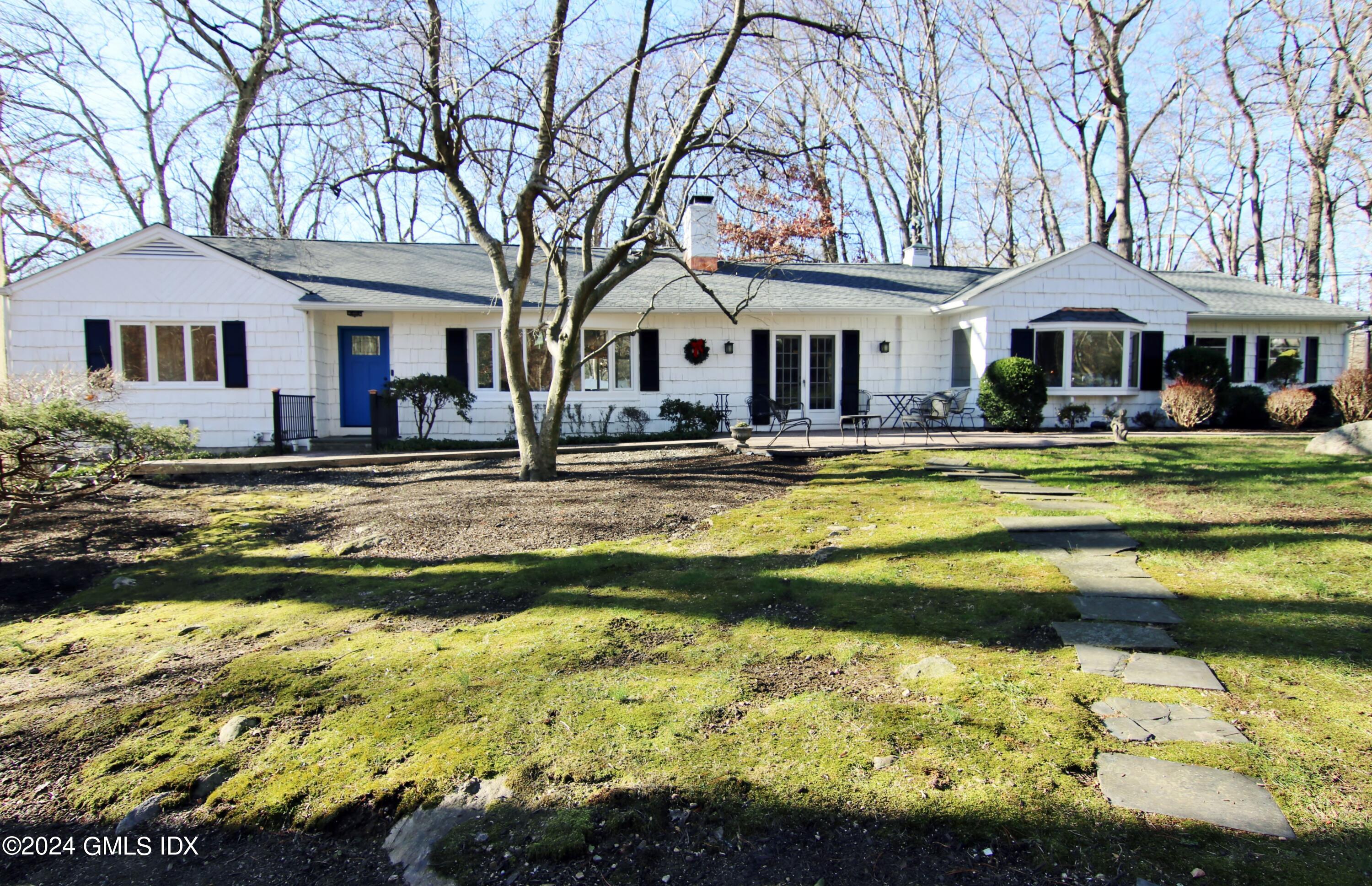 191 Sawmill Road Stamford, CT 06903 - Photo 1 of 40 a front view of a house with swimming pool