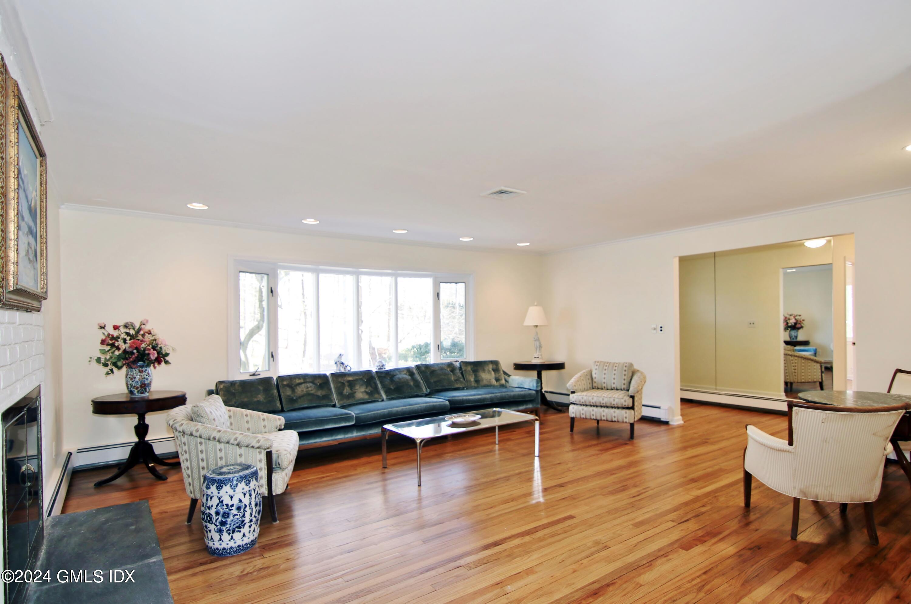 191 Sawmill Road Stamford, CT 06903 - Photo 11 of 40 a living room with furniture and a wooden floor