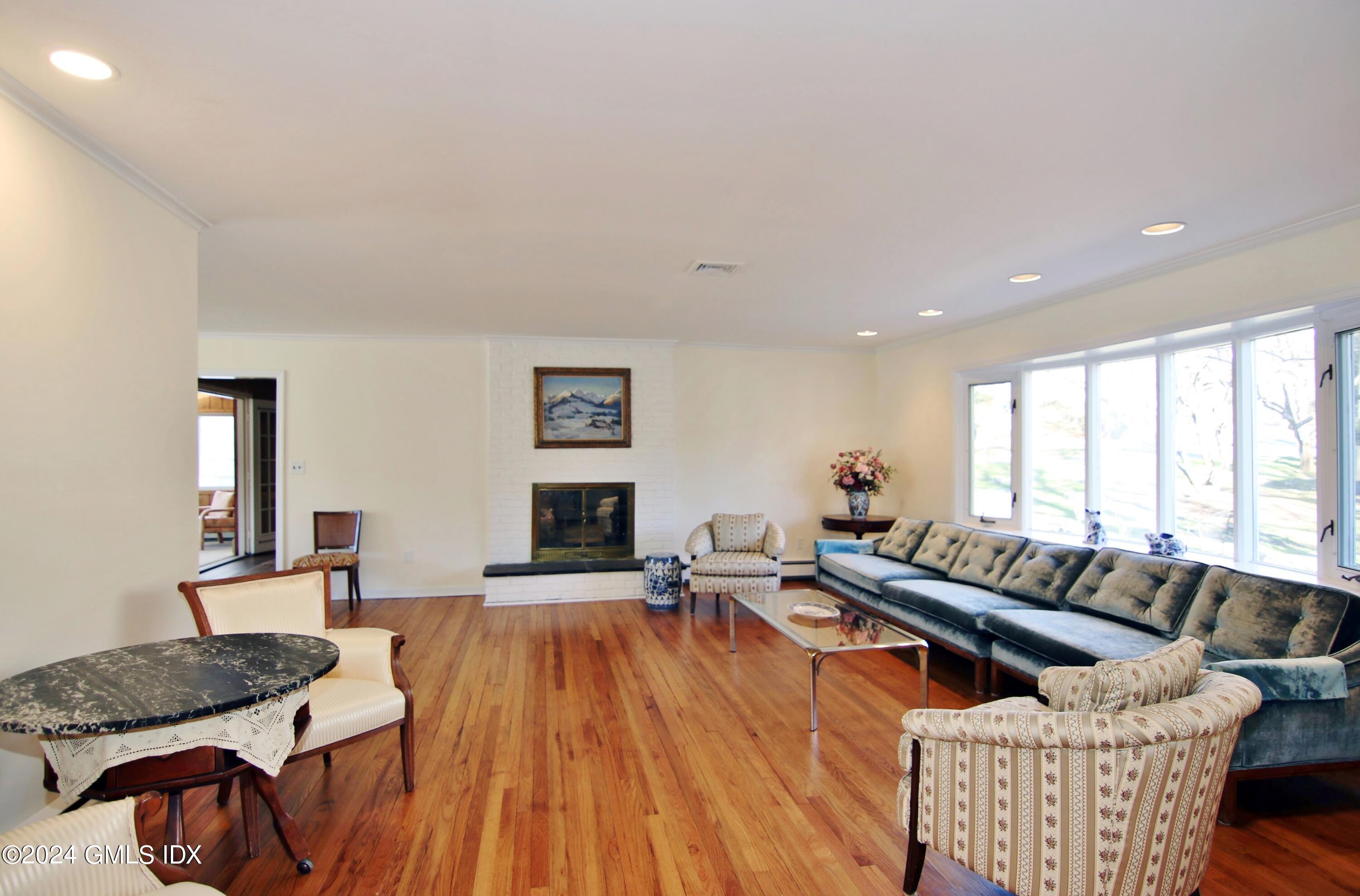 191 Sawmill Road Stamford, CT 06903 - Photo 12 of 40 a living room with furniture and a large window