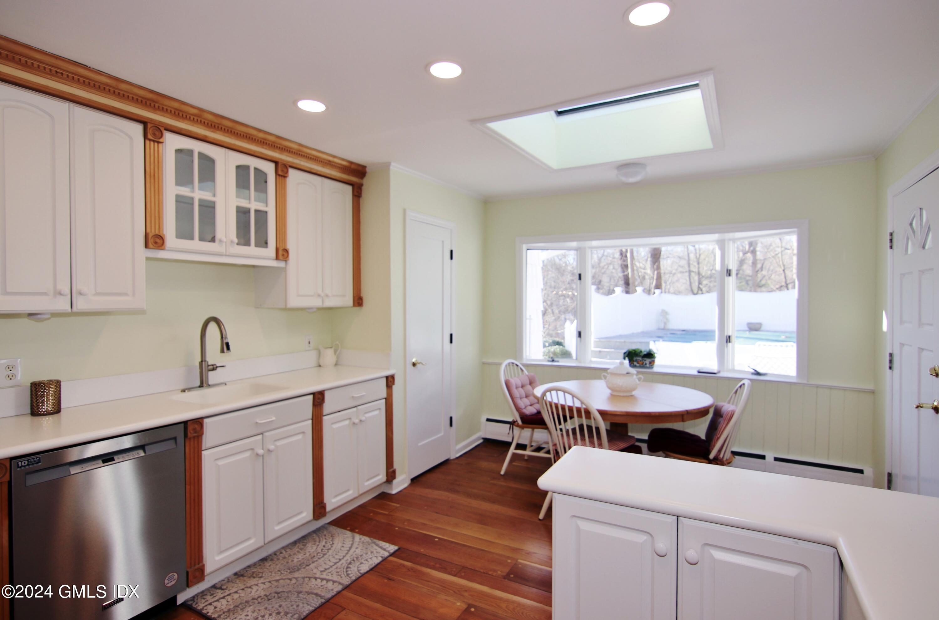 191 Sawmill Road Stamford, CT 06903 - Photo 16 of 40 a kitchen with a sink stove and cabinets