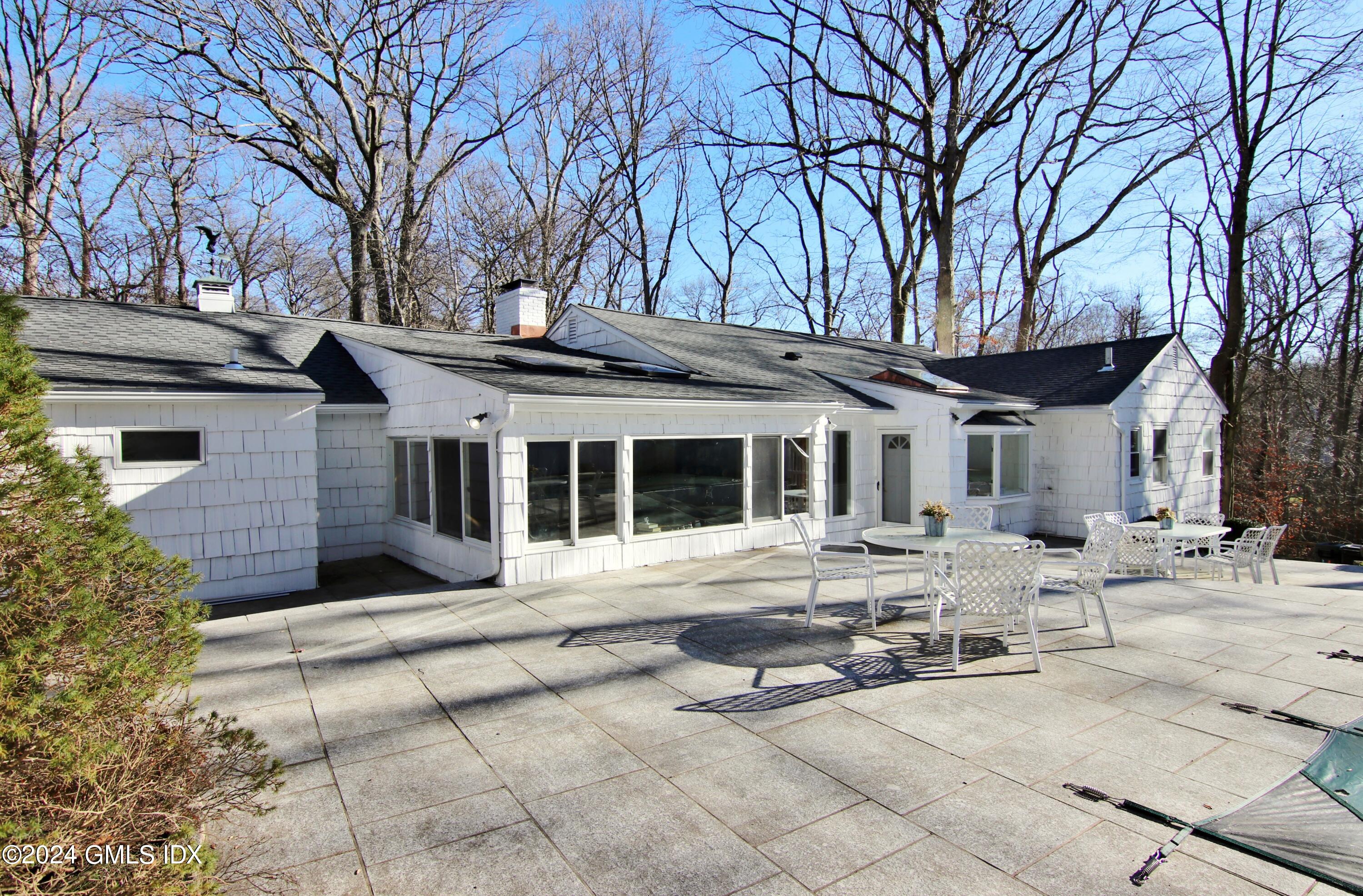191 Sawmill Road Stamford, CT 06903 - Photo 2 of 40 a view of a house with a yard and sitting area