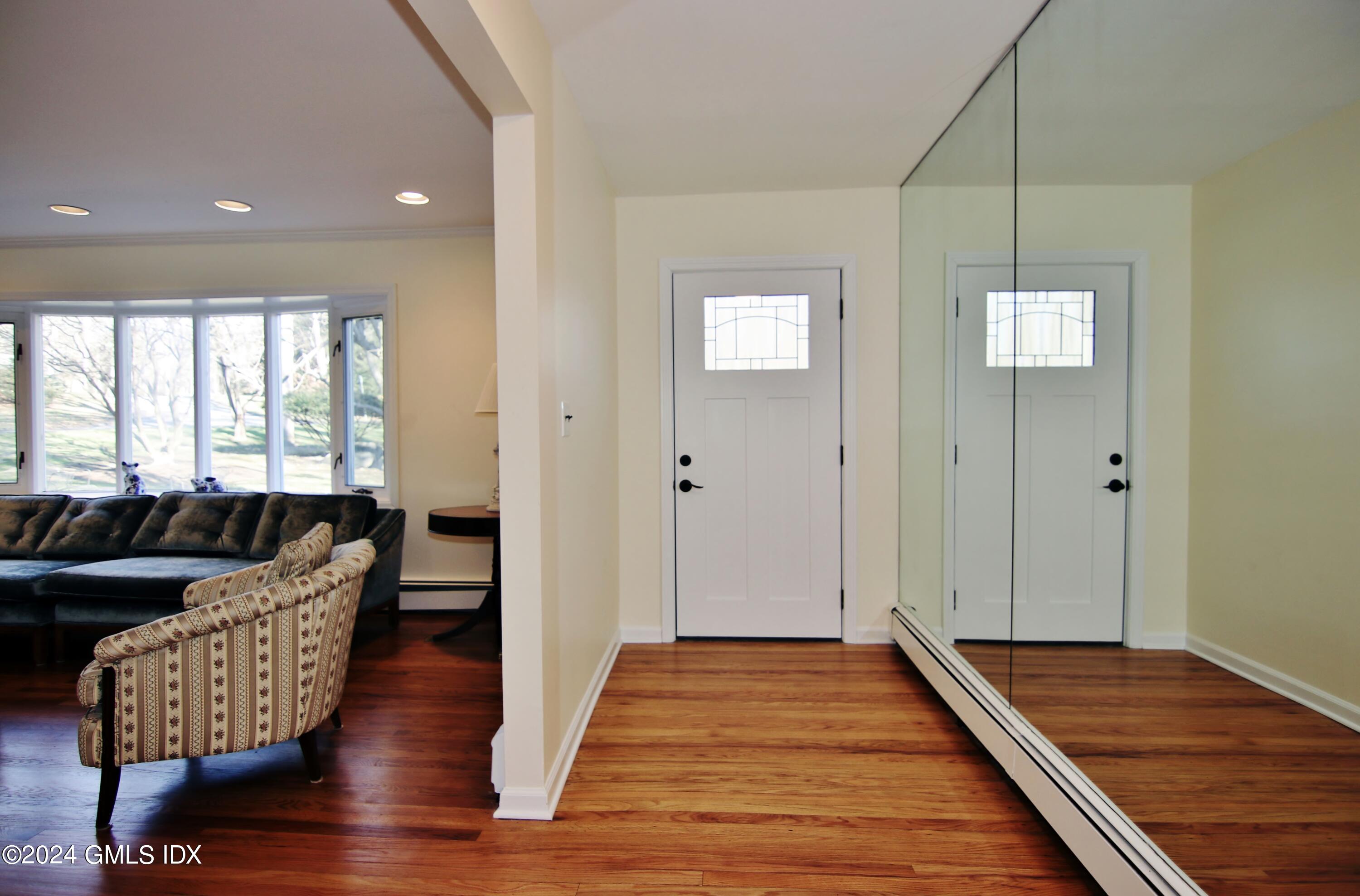 191 Sawmill Road Stamford, CT 06903 - Photo 24 of 40 a living room with furniture and wooden floor