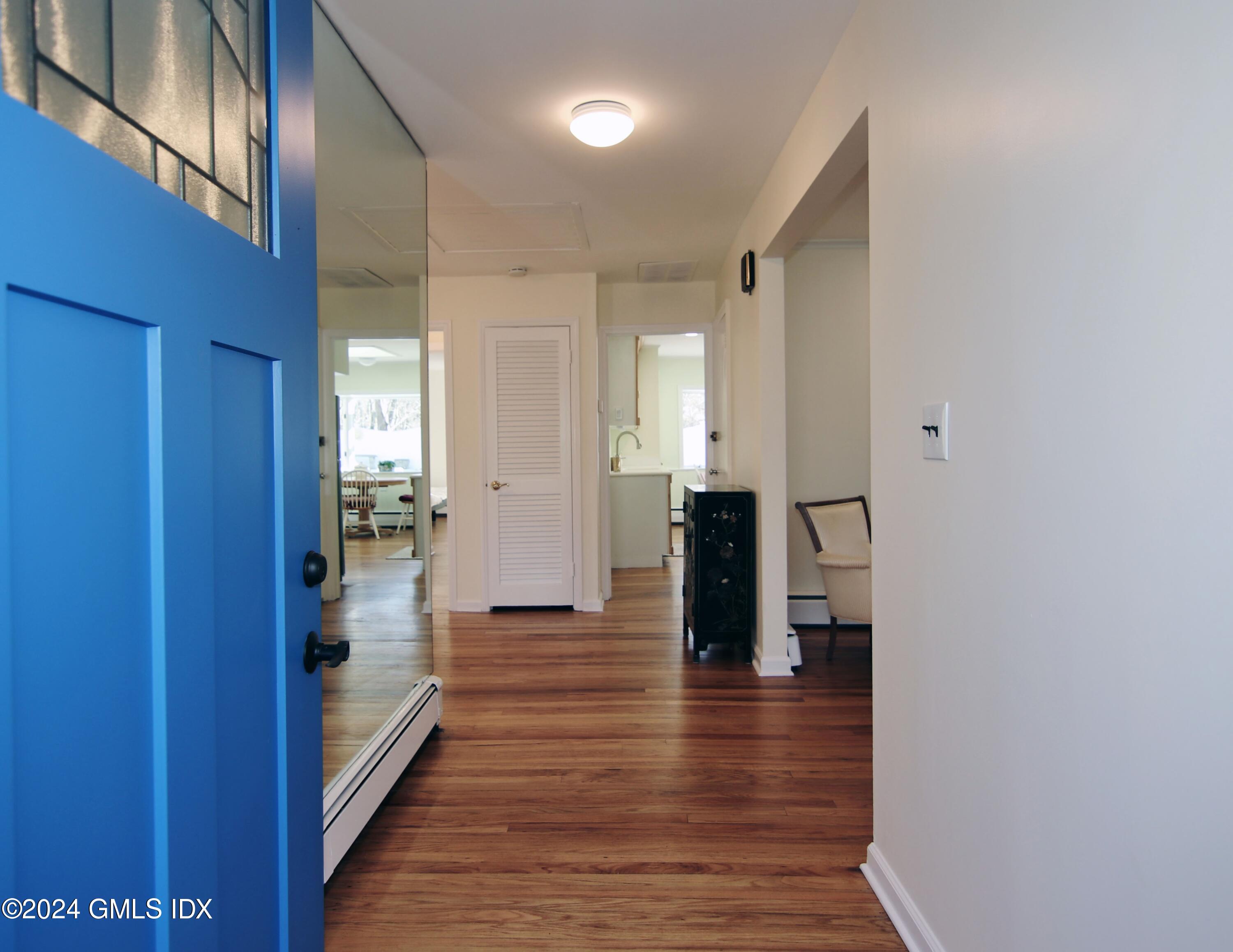 191 Sawmill Road Stamford, CT 06903 - Photo 26 of 40 a view of a hallway with wooden floor