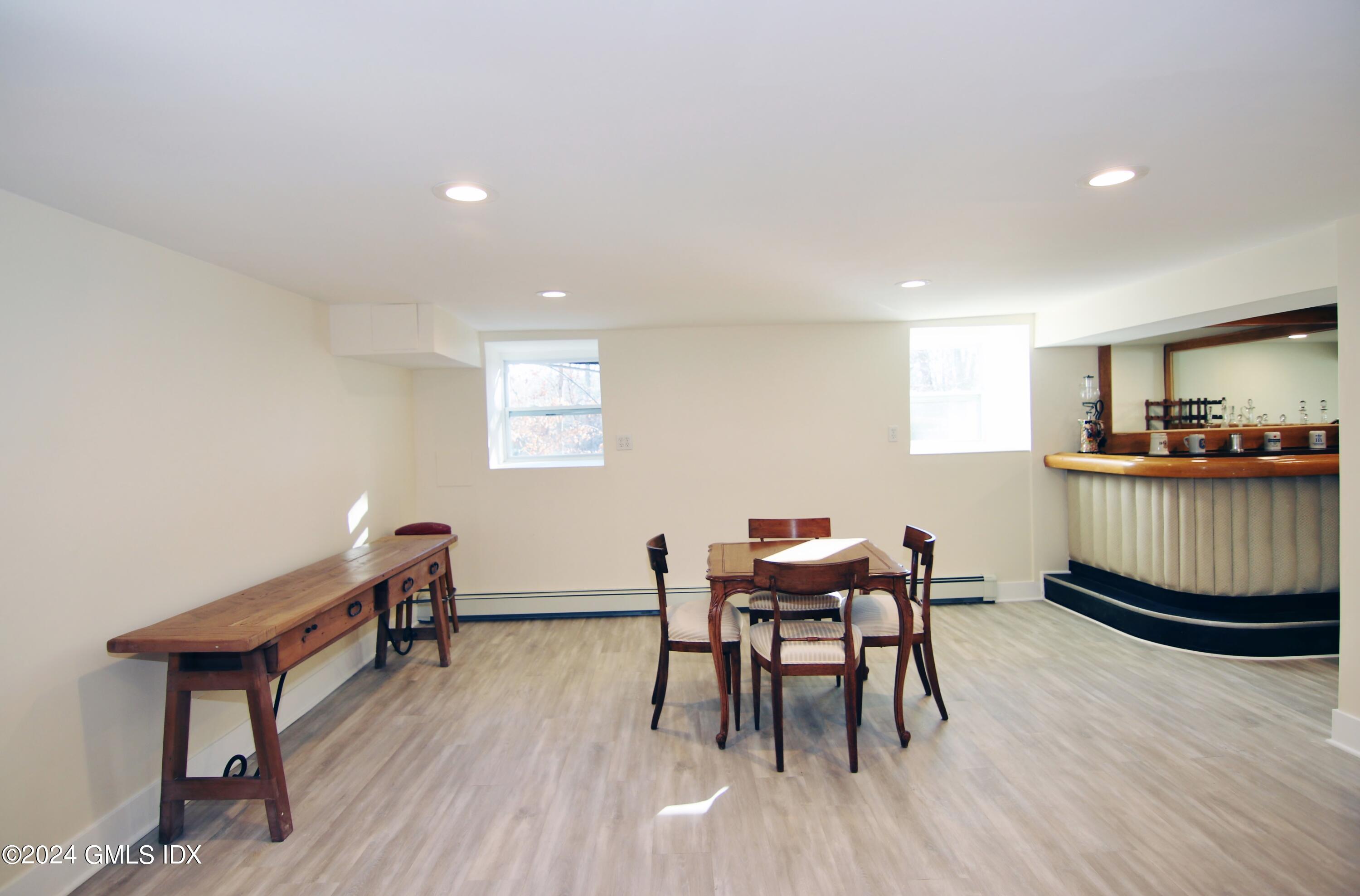 191 Sawmill Road Stamford, CT 06903 - Photo 33 of 40 a workspace with furniture and wooden floor
