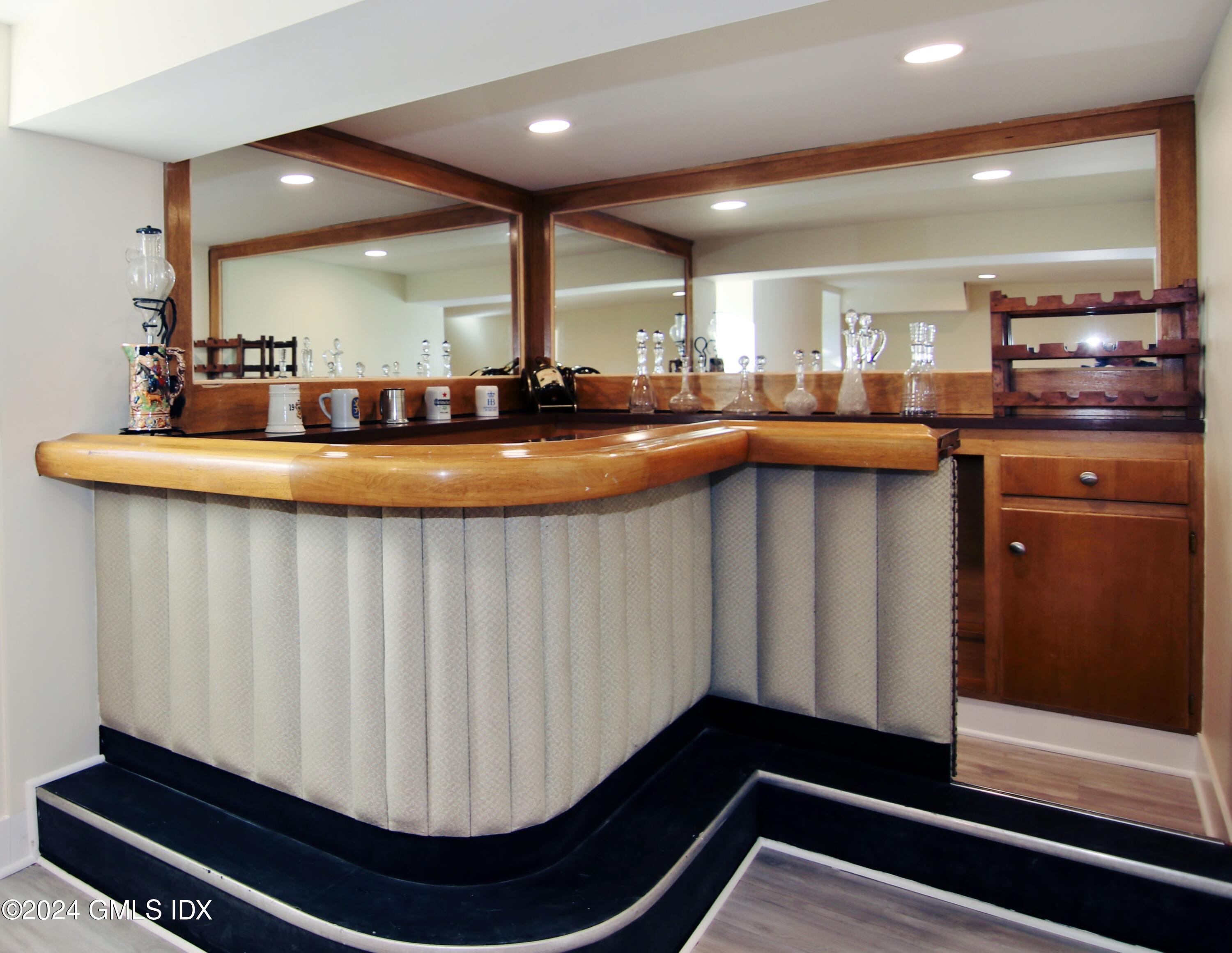 191 Sawmill Road Stamford, CT 06903 - Photo 34 of 40 a kitchen with kitchen island granite countertop a sink and cabinets