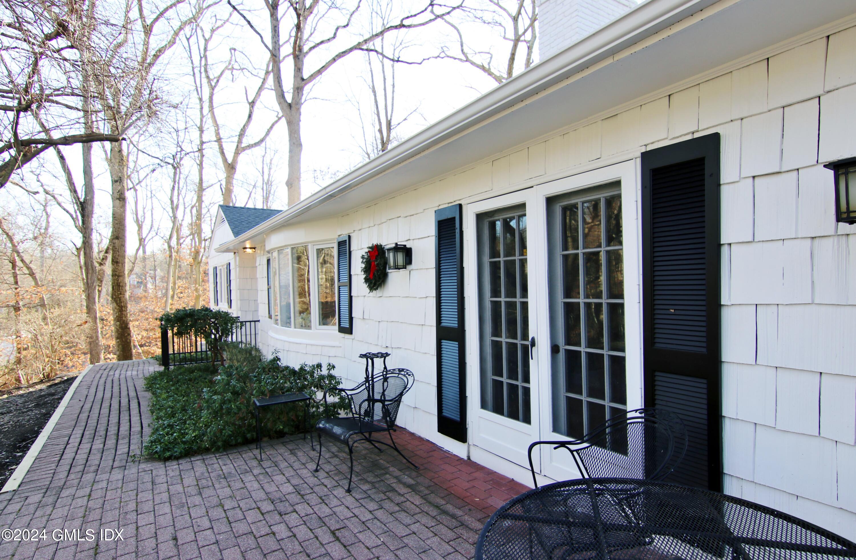 191 Sawmill Road Stamford, CT 06903 - Photo 36 of 40 a view of a house with backyard and sitting area