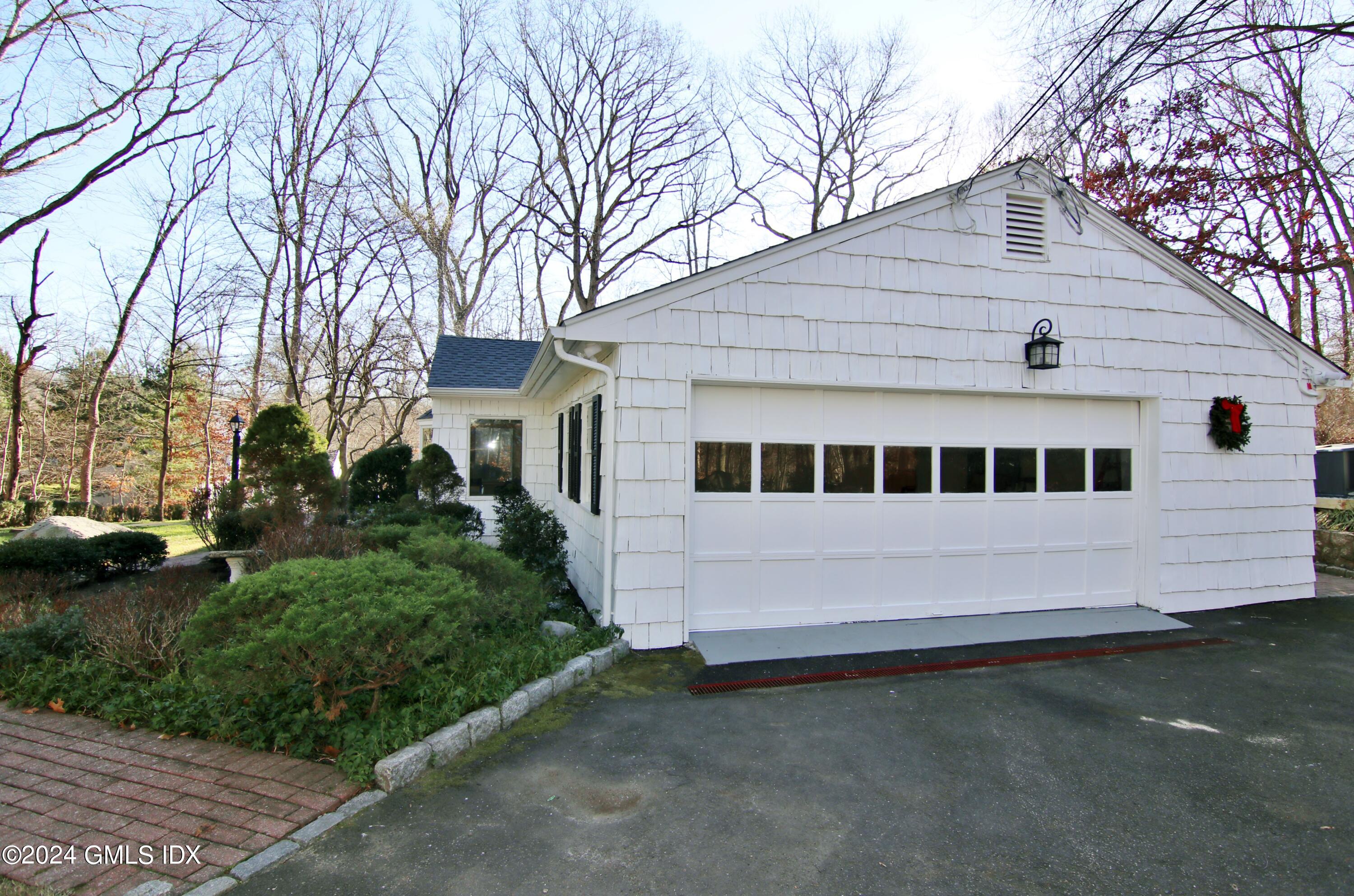 191 Sawmill Road Stamford, CT 06903 - Photo 38 of 40 a view of a house with a yard