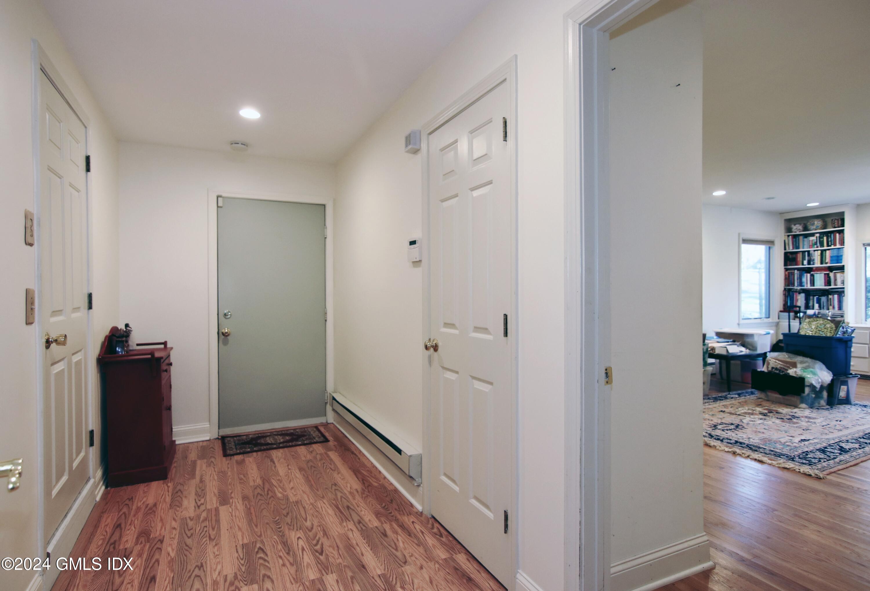 191 Sawmill Road Stamford, CT 06903 - Photo 6 of 40 a view of a hallway with wooden floor and closet