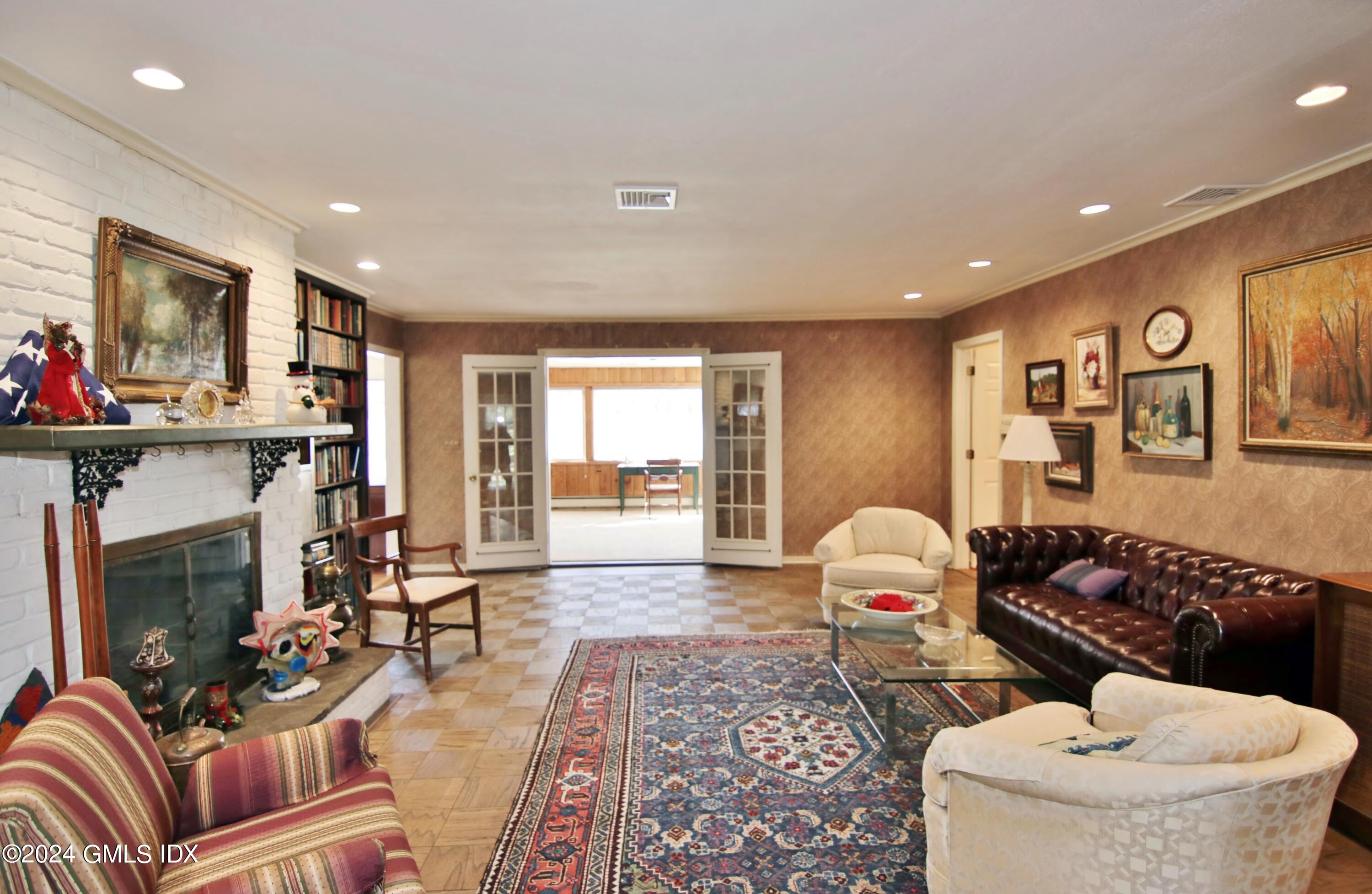 191 Sawmill Road Stamford, CT 06903 - Photo 8 of 40 a living room with furniture and a fireplace