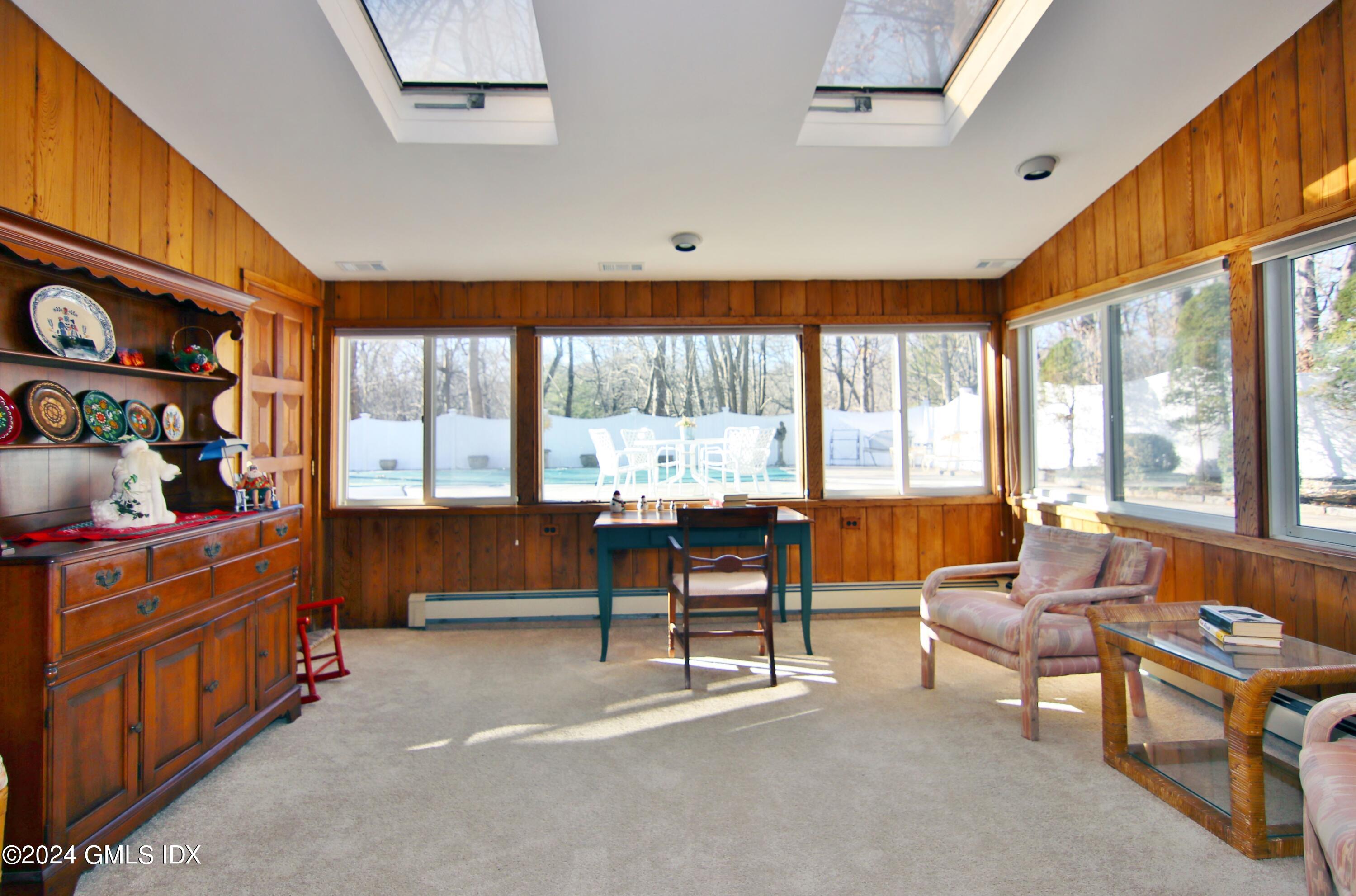 191 Sawmill Road Stamford, CT 06903 - Photo 10 of 40 a living room with furniture and a large window