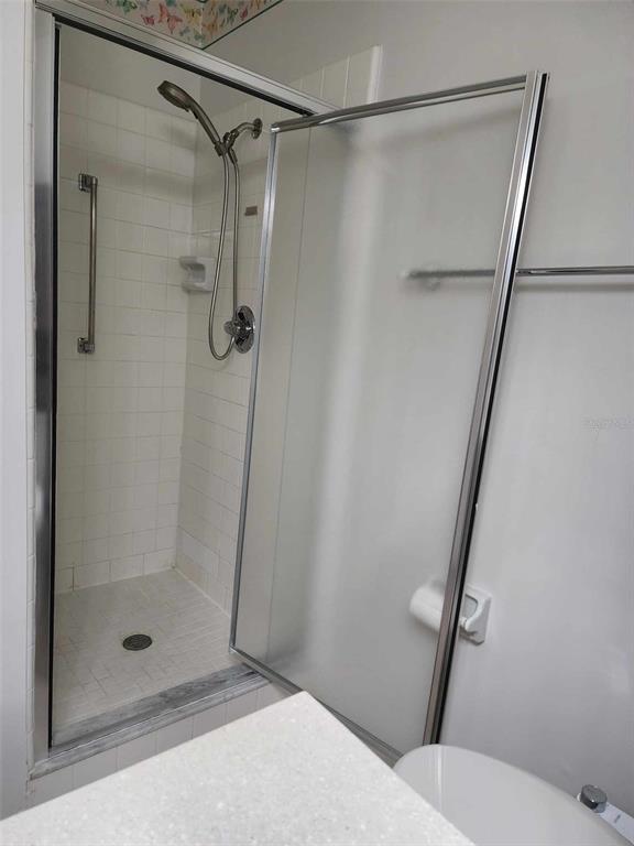 1102 Halton Court, Unit 1102 Sun City Center, FL 33573 - Photo 17 of 58 a bathroom with a shower and toilet