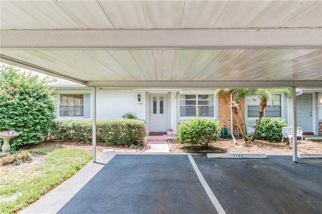 1102 Halton Court, Unit 1102 Sun City Center, FL 33573 - Photo 2 of 58 a front view of a house with garden