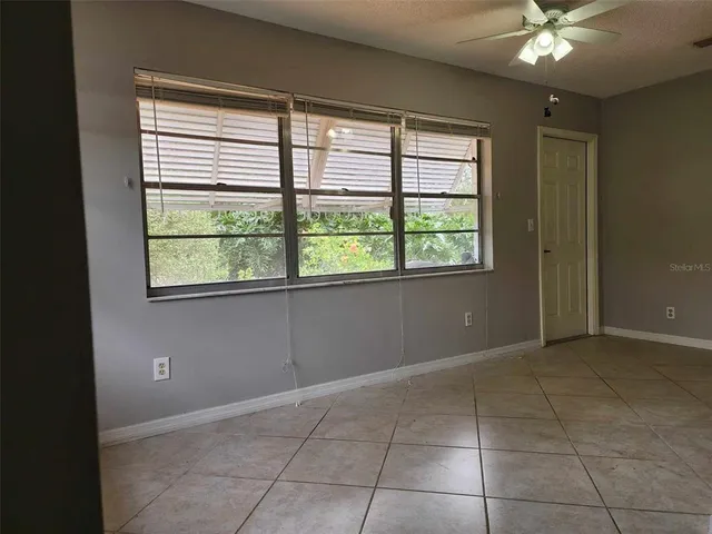 a utility room with cabinets washer and dryer