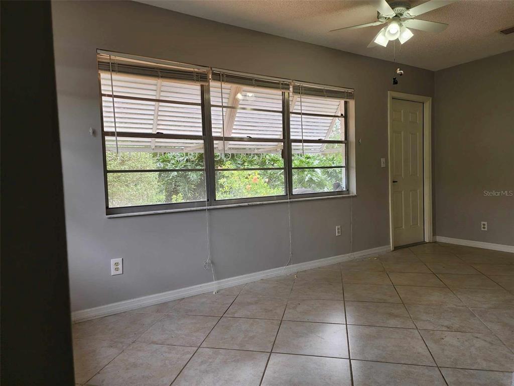 1102 Halton Court, Unit 1102 Sun City Center, FL 33573 - Photo 28 of 58 a view of an empty room with a window