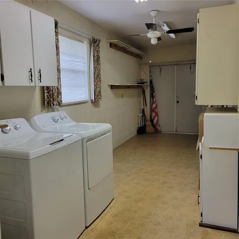 a bathroom with a sink a mirror and shower
