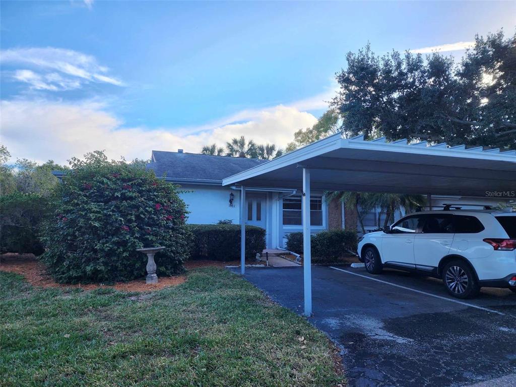 1102 Halton Court, Unit 1102 Sun City Center, FL 33573 - Photo 37 of 58 a car parked in front of a house