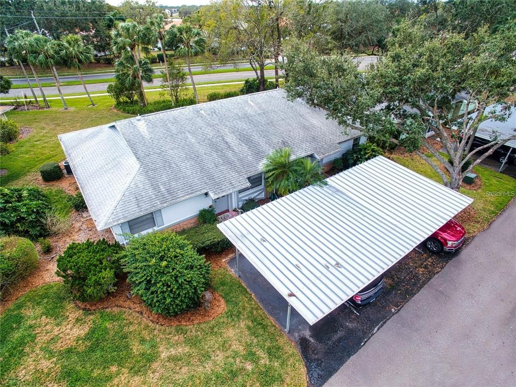 1102 Halton Court, Unit 1102 Sun City Center, FL 33573 - Photo 39 of 58 an aerial view of a house with a garden and lake view
