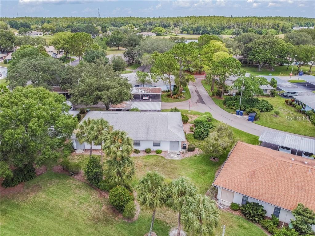 1102 Halton Court, Unit 1102 Sun City Center, FL 33573 - Photo 40 of 58 an aerial view of residential houses with outdoor space and street view