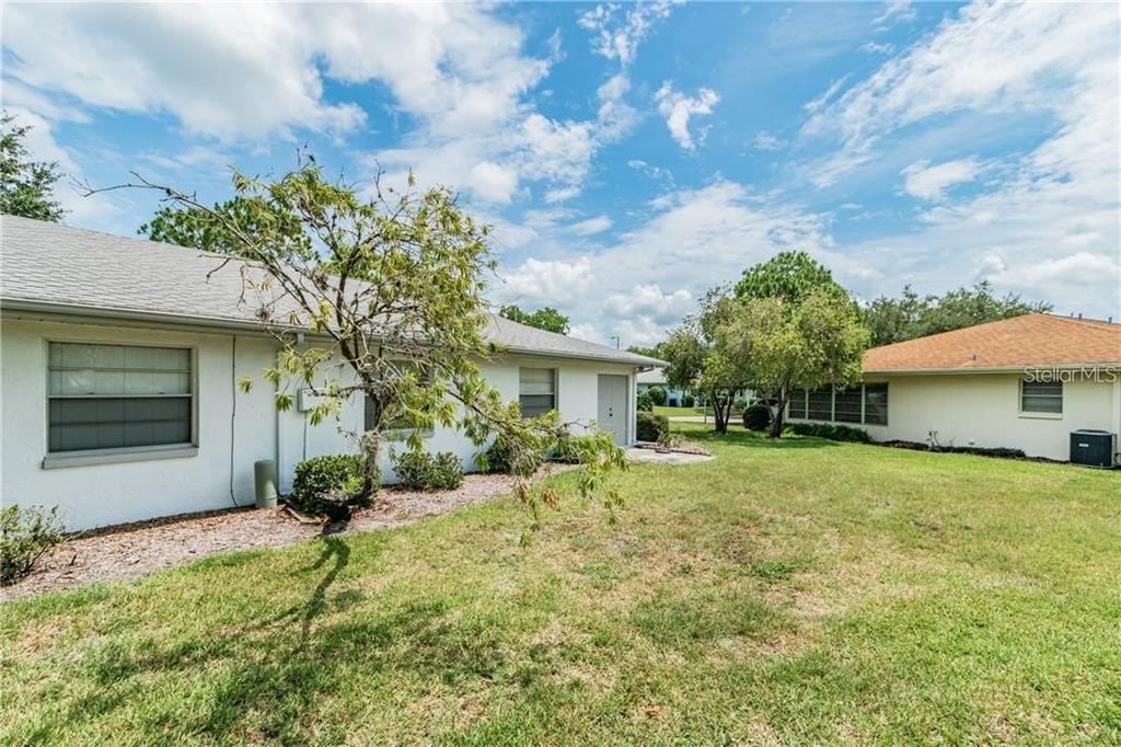 1102 Halton Court, Unit 1102 Sun City Center, FL 33573 - Photo 42 of 58 a view of a house with a yard