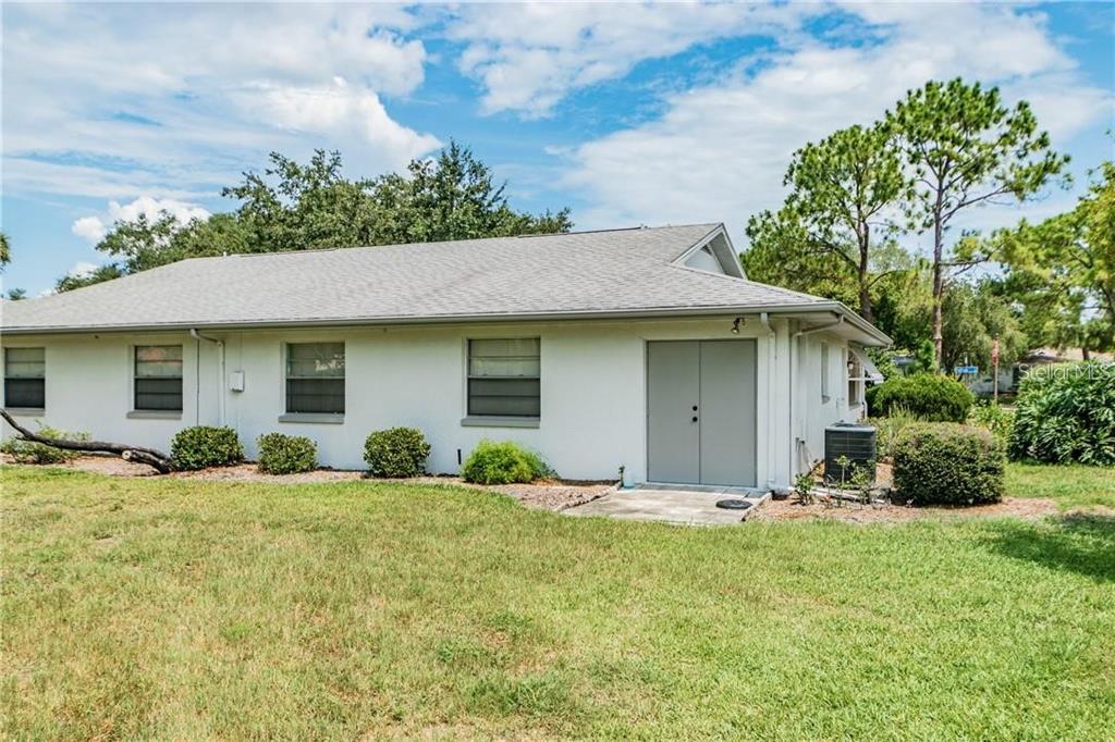 1102 Halton Court, Unit 1102 Sun City Center, FL 33573 - Photo 43 of 58 front view of a house with a yard