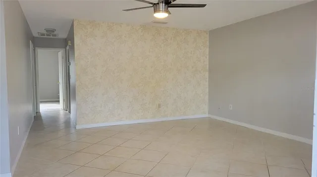 a kitchen with cabinets stainless steel appliances and a counter space