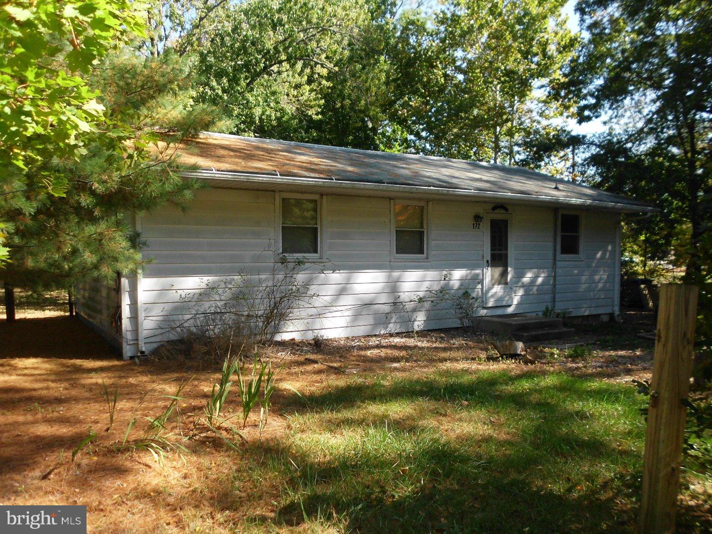 172 Arneys Mt Road Pemberton, NJ 08068 - Photo 2 of 24 a backyard of a house with table and chairs