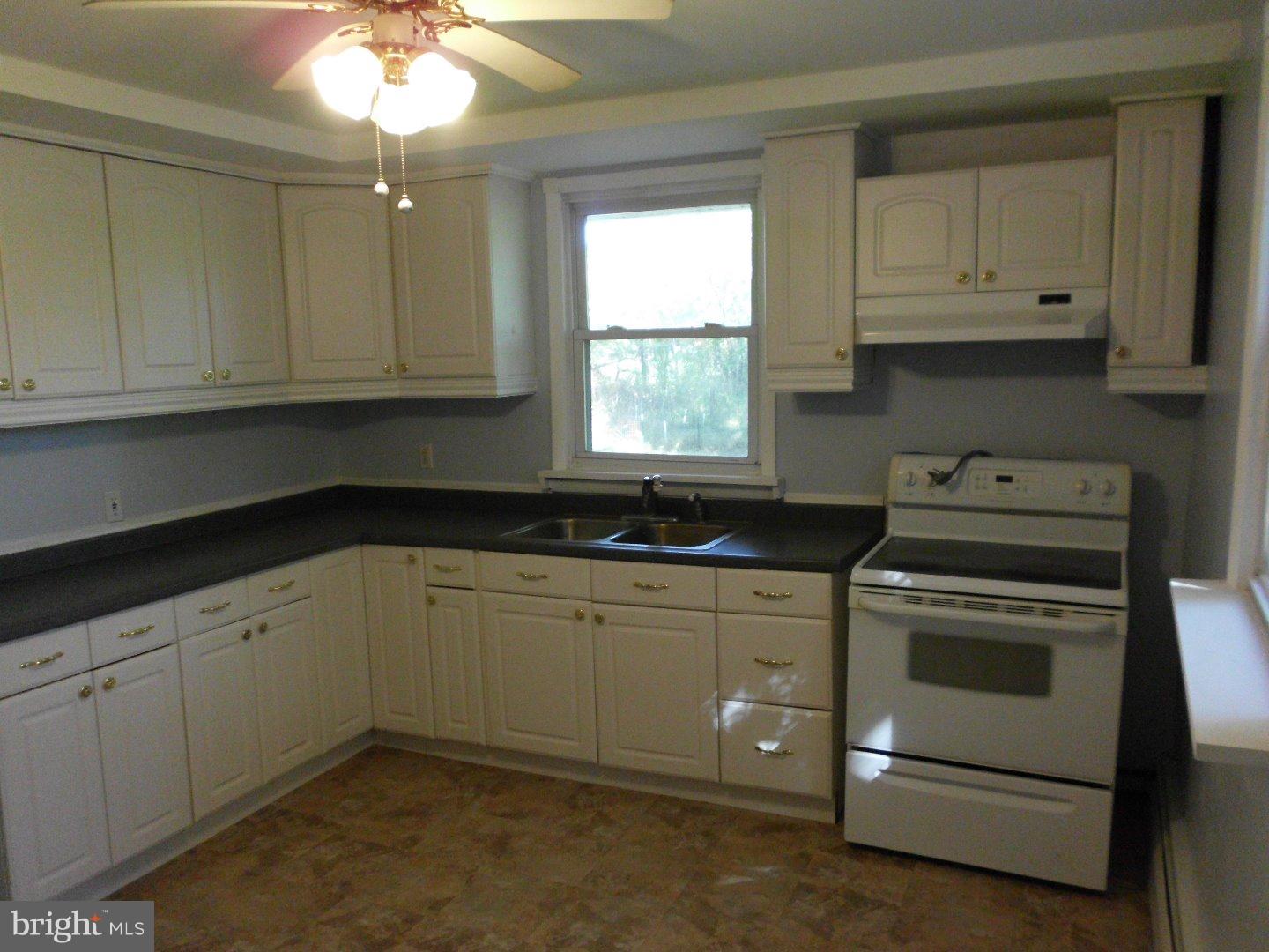 172 Arneys Mt Road Pemberton, NJ 08068 - Photo 12 of 24 a kitchen with granite countertop white cabinets and white appliances