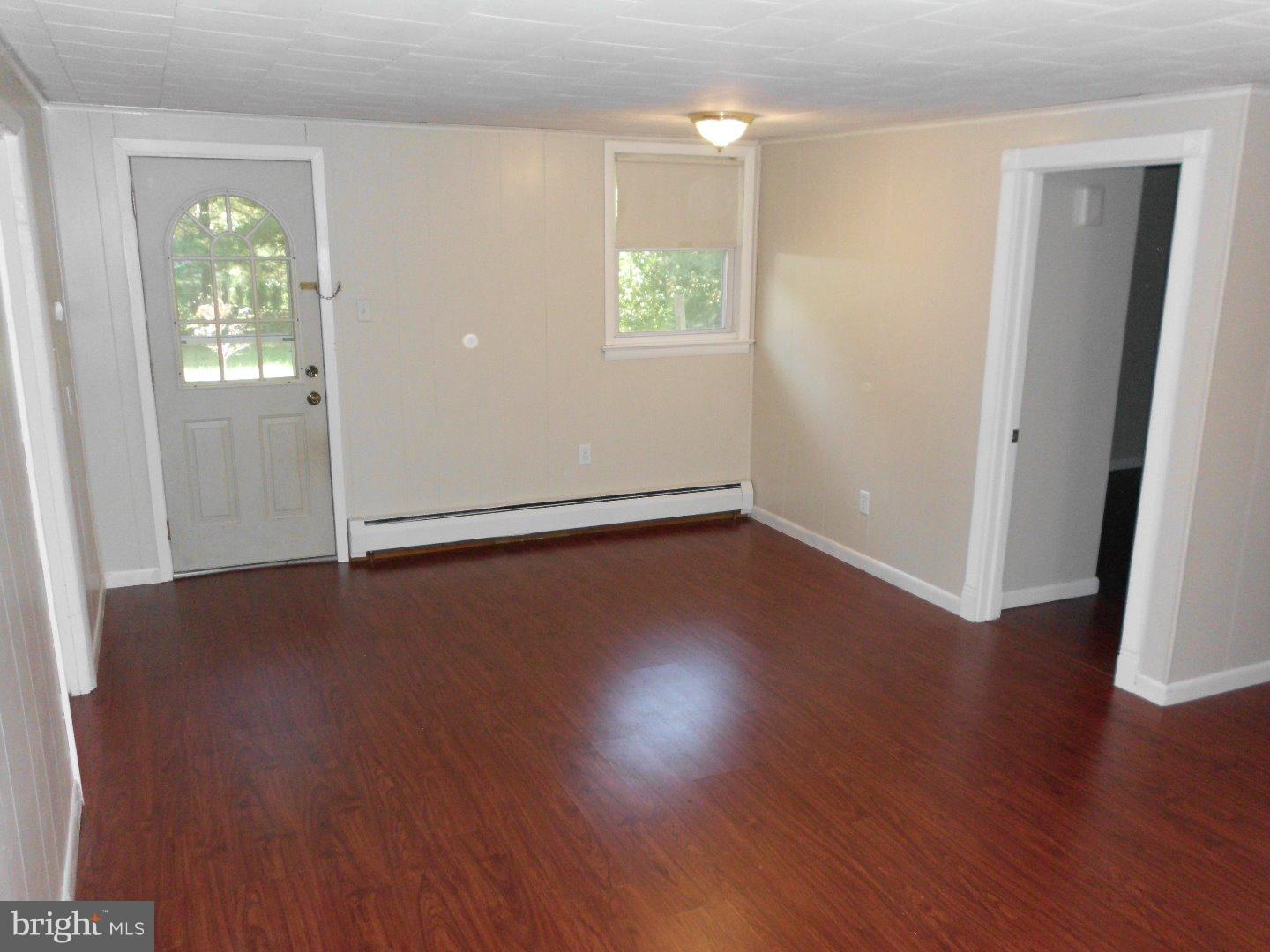 172 Arneys Mt Road Pemberton, NJ 08068 - Photo 17 of 24 an empty room with wooden floor and windows
