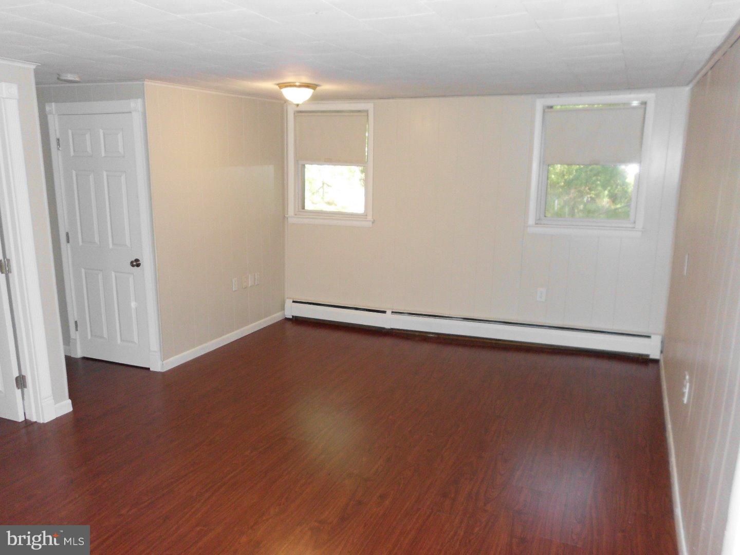172 Arneys Mt Road Pemberton, NJ 08068 - Photo 18 of 24 an empty room with wooden floor and windows