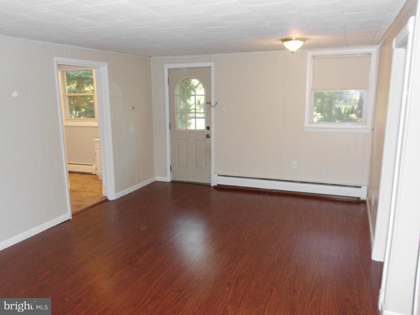 172 Arneys Mt Road Pemberton, NJ 08068 - Photo 19 of 24 an empty room with wooden floor and windows