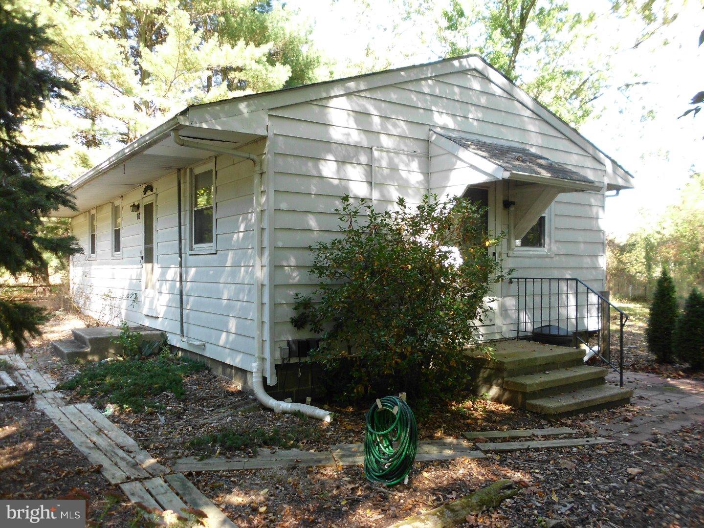172 Arneys Mt Road Pemberton, NJ 08068 - Photo 4 of 24 a front view of a house with garden