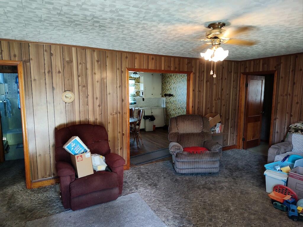 483 Laurel Branch Road Northwest Floyd, VA 24091 - Photo 4 of 19 a living room with furniture and a chandelier