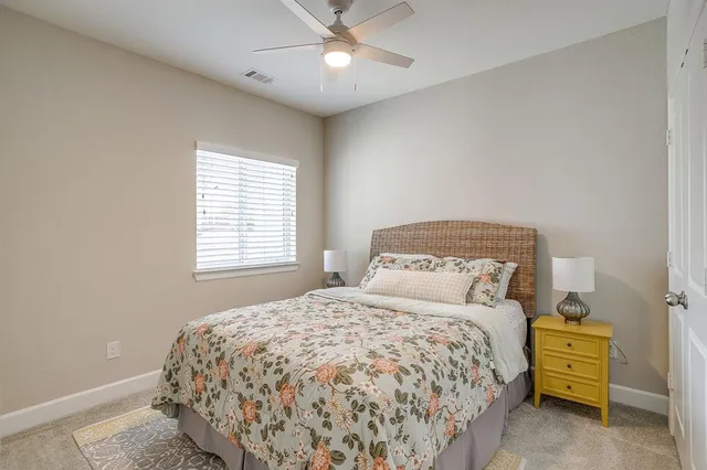 a bedroom with a bed and window