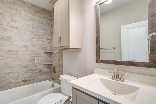 a bathroom with a sink toilet and a bathtub