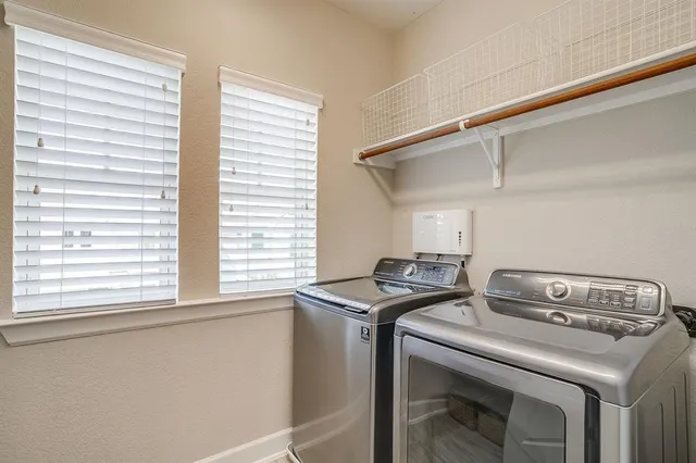 a utility room with washer and dryer