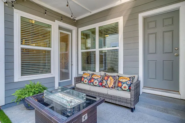 a outdoor living space with furniture and a potted plant