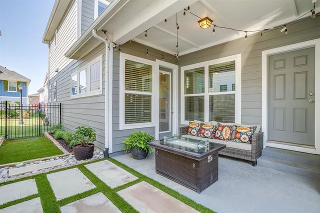a living room filled with furniture and garden view