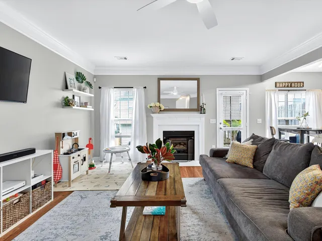 a living room with furniture and a fireplace