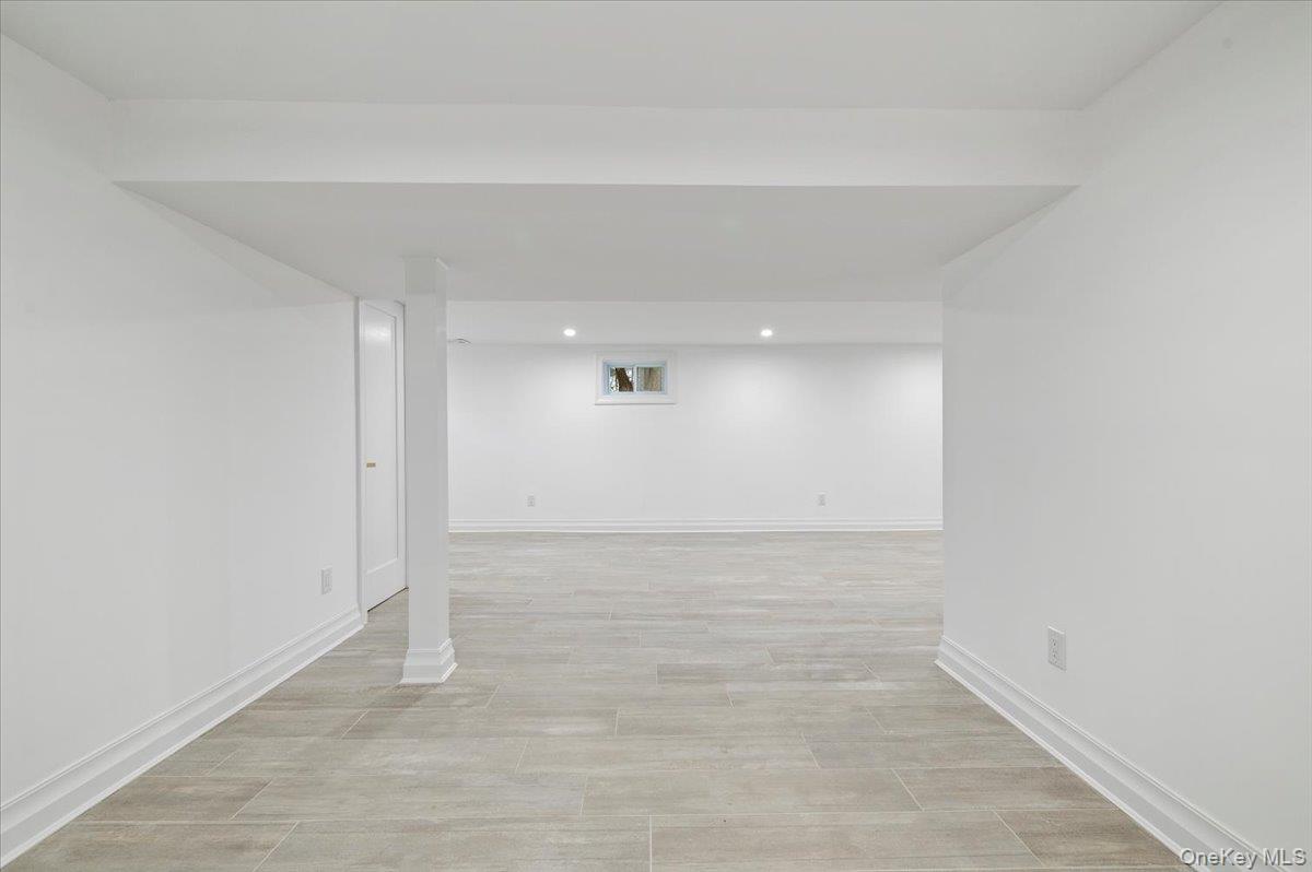 168 Martens Avenue Valley Stream, NY 11580 - Photo 21 of 26 Finished below grade area featuring recessed lighting and light wood-style floors