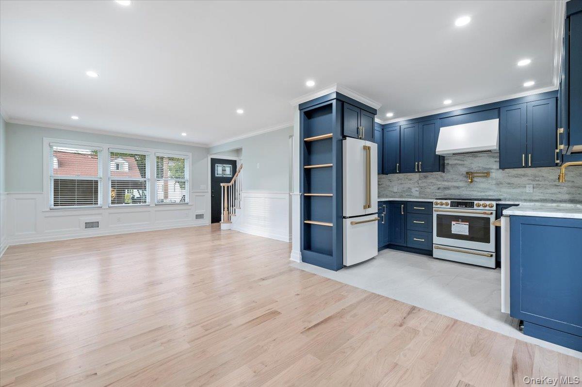168 Martens Avenue Valley Stream, NY 11580 - Photo 9 of 26 Kitchen featuring white appliances, exhaust hood, light wood finished floors, recessed lighting, and open shelves