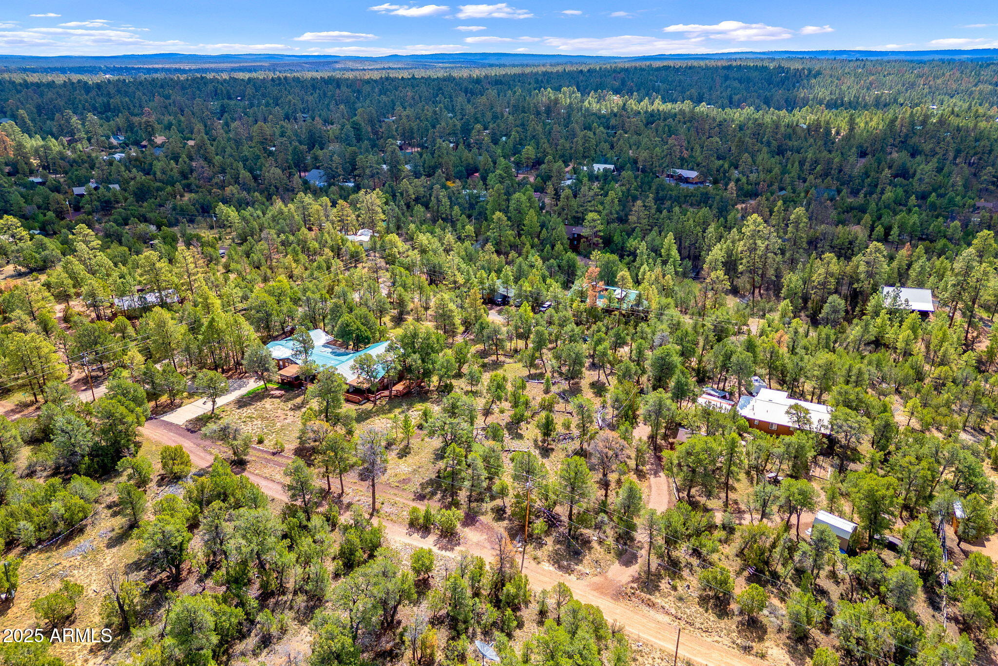 1909 Chevelon Road, Unit 1909 Heber, AZ 85928 - Photo 6 of 16 a view of a city with lush green forest