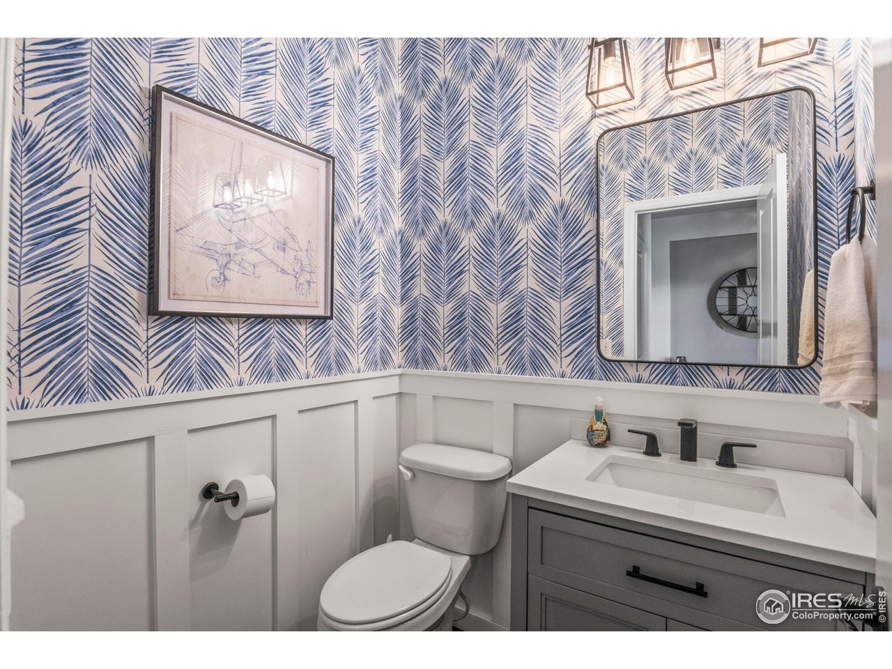 9570 Kendrick Way Arvada, CO 80007 - Photo 14 of 43 a bathroom with a sink mirror vanity and toilet