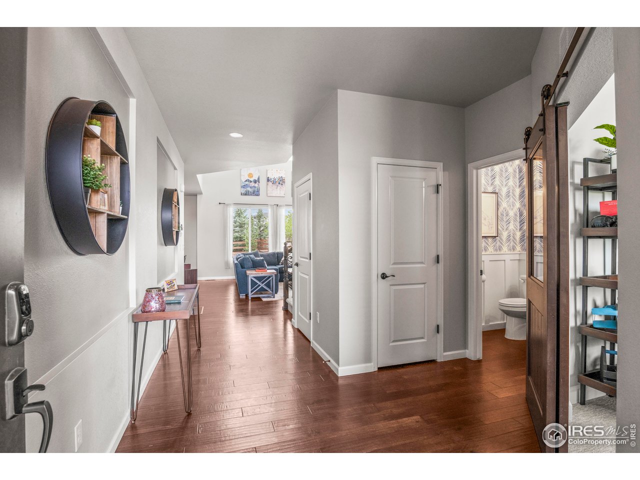 9570 Kendrick Way Arvada, CO 80007 - Photo 15 of 43 a living room with furniture and a wooden floor
