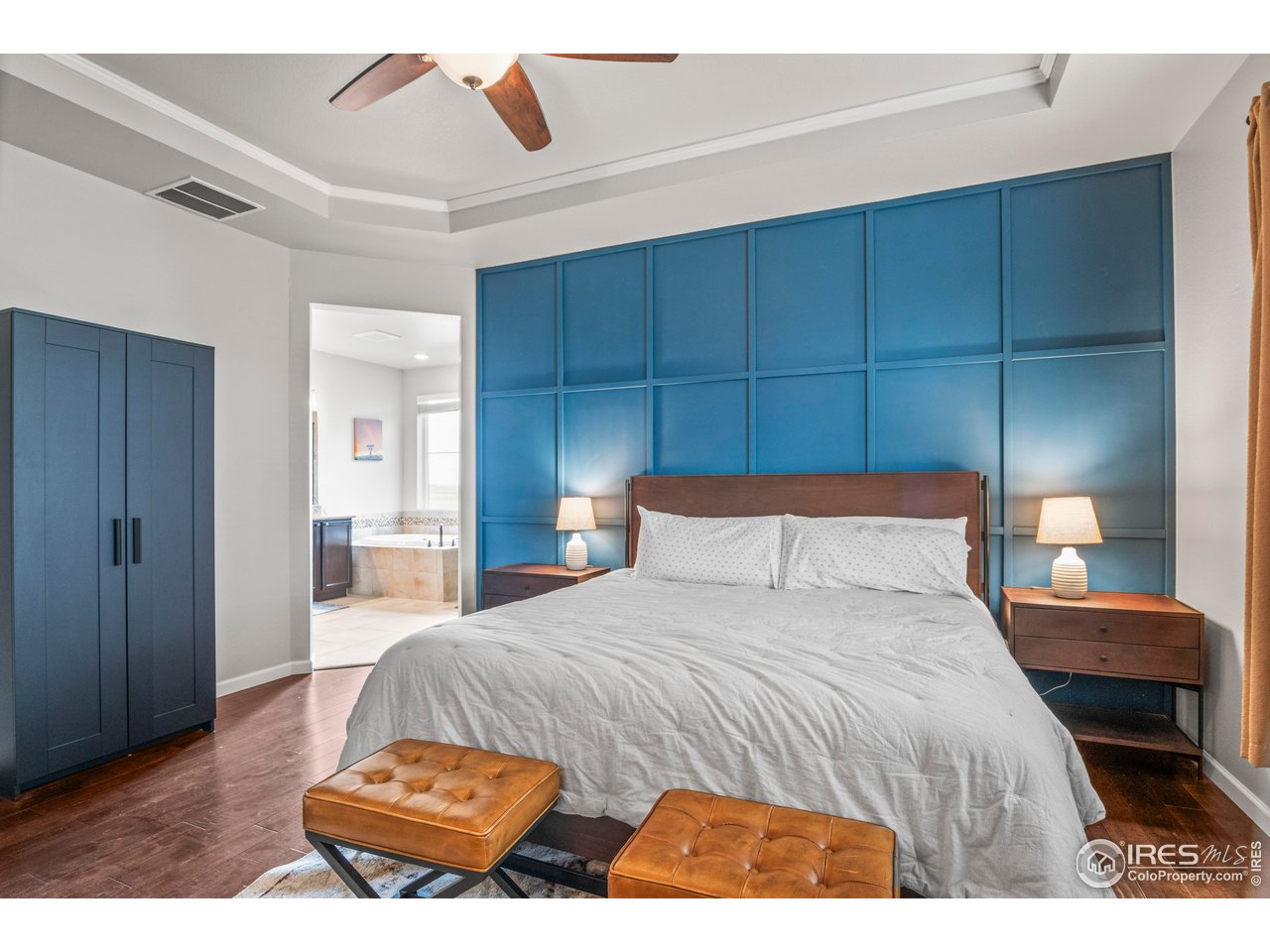 9570 Kendrick Way Arvada, CO 80007 - Photo 17 of 43 a bedroom with a bed and a cabinets