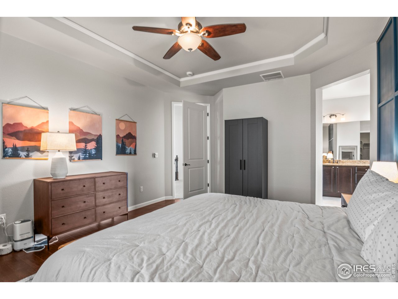 9570 Kendrick Way Arvada, CO 80007 - Photo 19 of 43 a bedroom with a bed and a dresser