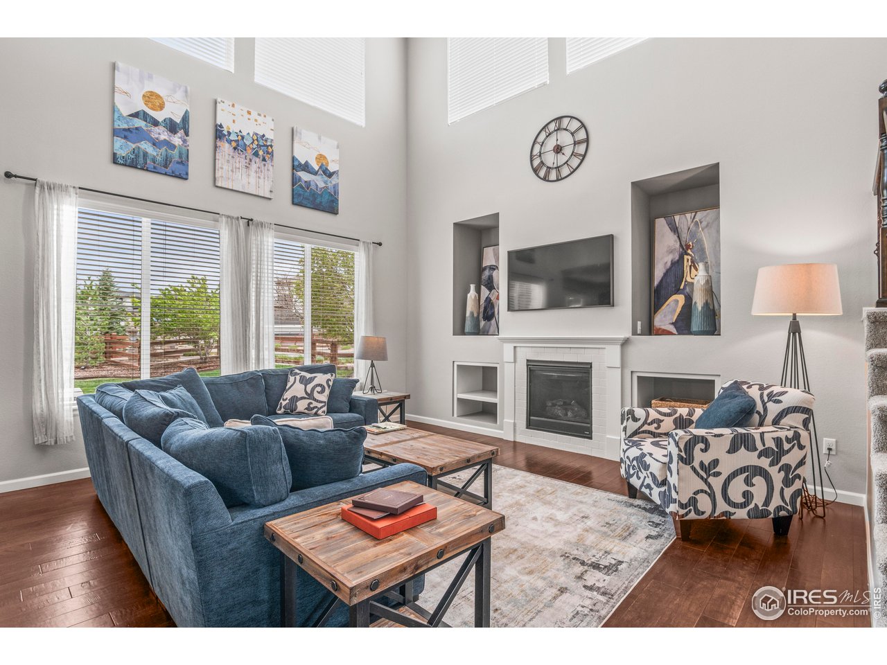 9570 Kendrick Way Arvada, CO 80007 - Photo 2 of 43 a living room with fireplace furniture and a flat screen tv
