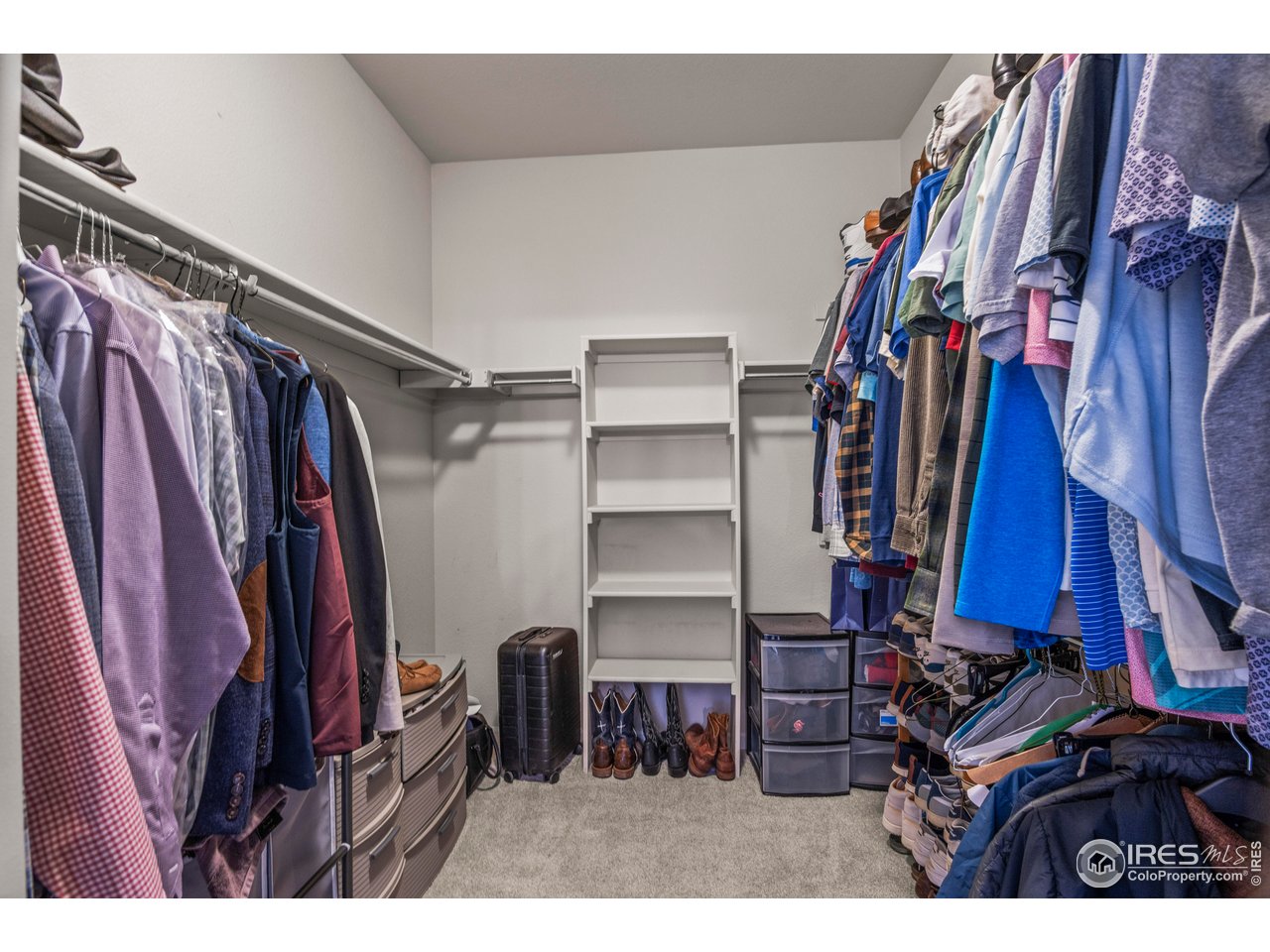 9570 Kendrick Way Arvada, CO 80007 - Photo 23 of 43 a view of walk in closet with clothes and shoes