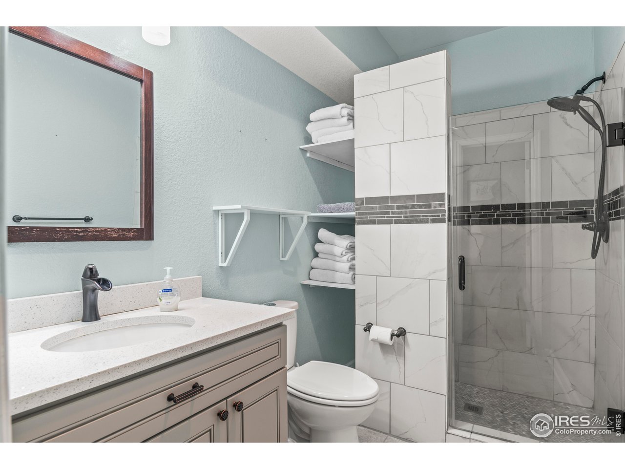 9570 Kendrick Way Arvada, CO 80007 - Photo 29 of 43 a bathroom with a sink toilet and shower